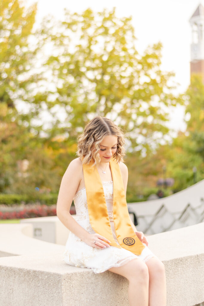 Purdue University grad photo sitting on engineering fountain